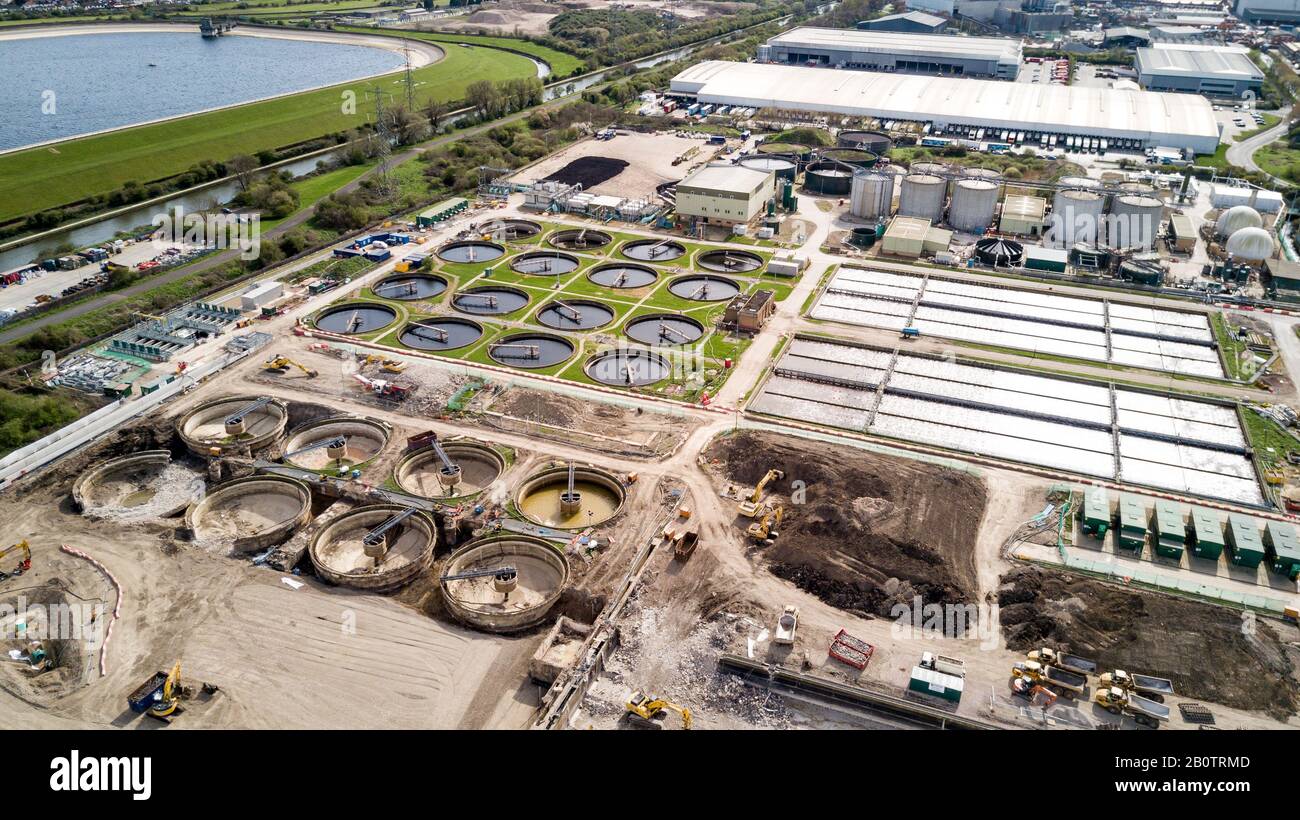 Sewage Farm: Aerial view of a waste water treatment processing plant, or sewage farm, and surrounding industrial estate in North London. Stock Photo