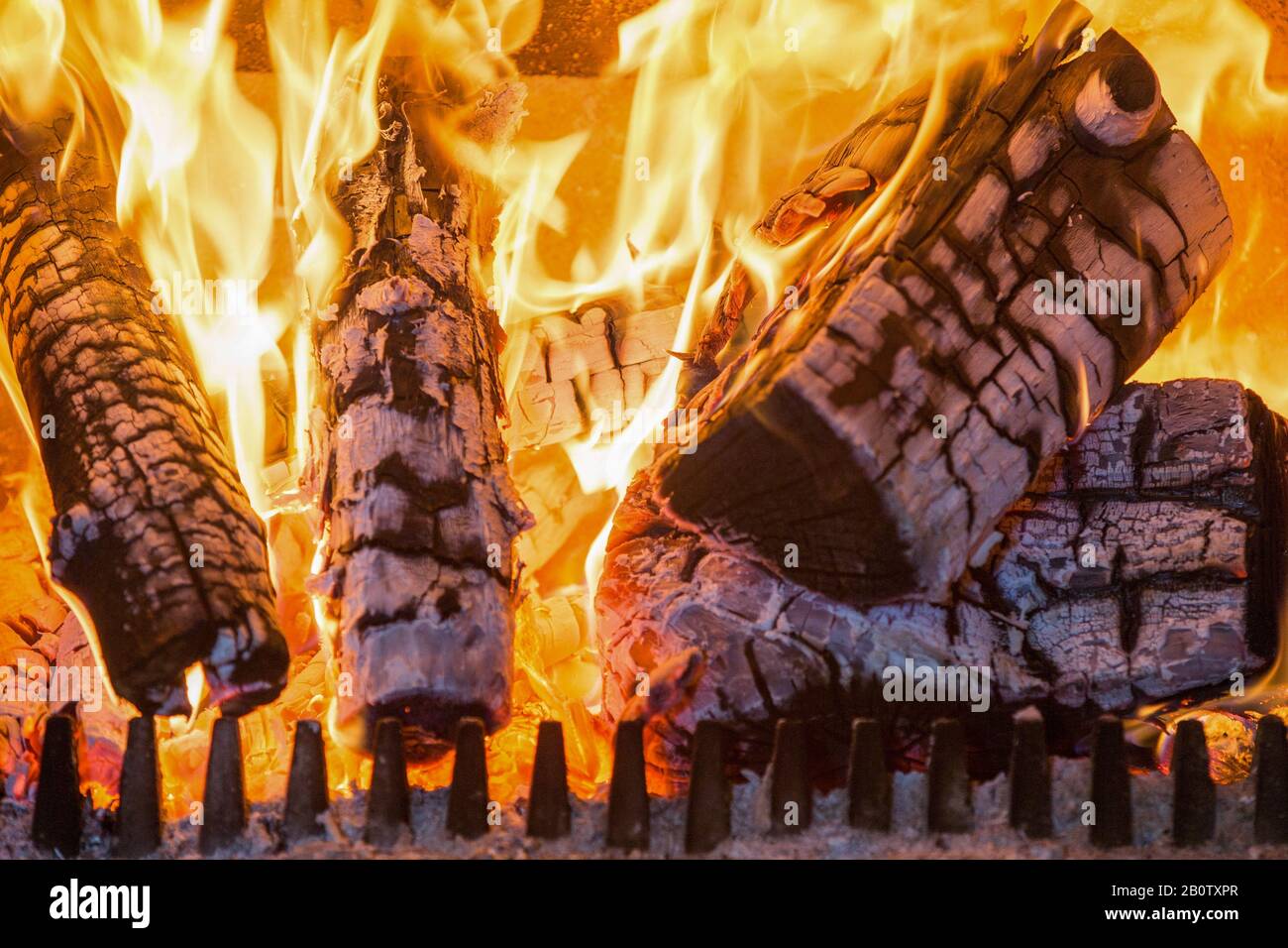Piicture shows wood on fire in a wood burning stove.   Owners of wood burners, stoves and open fires will no longer be able to buy coal or wet wood to burn in them, under a ban to be rolled out from next year. Sales of the two most polluting fuels will be phased out in England to help cut air pollution, the government says. Bags of logs sold in DIY stores, garden centres and petrol stations often contain wet wood - a type of wood which produces more pollution and smoke. The public should move to 'cleaner alternatives', the government says. Stock Photo