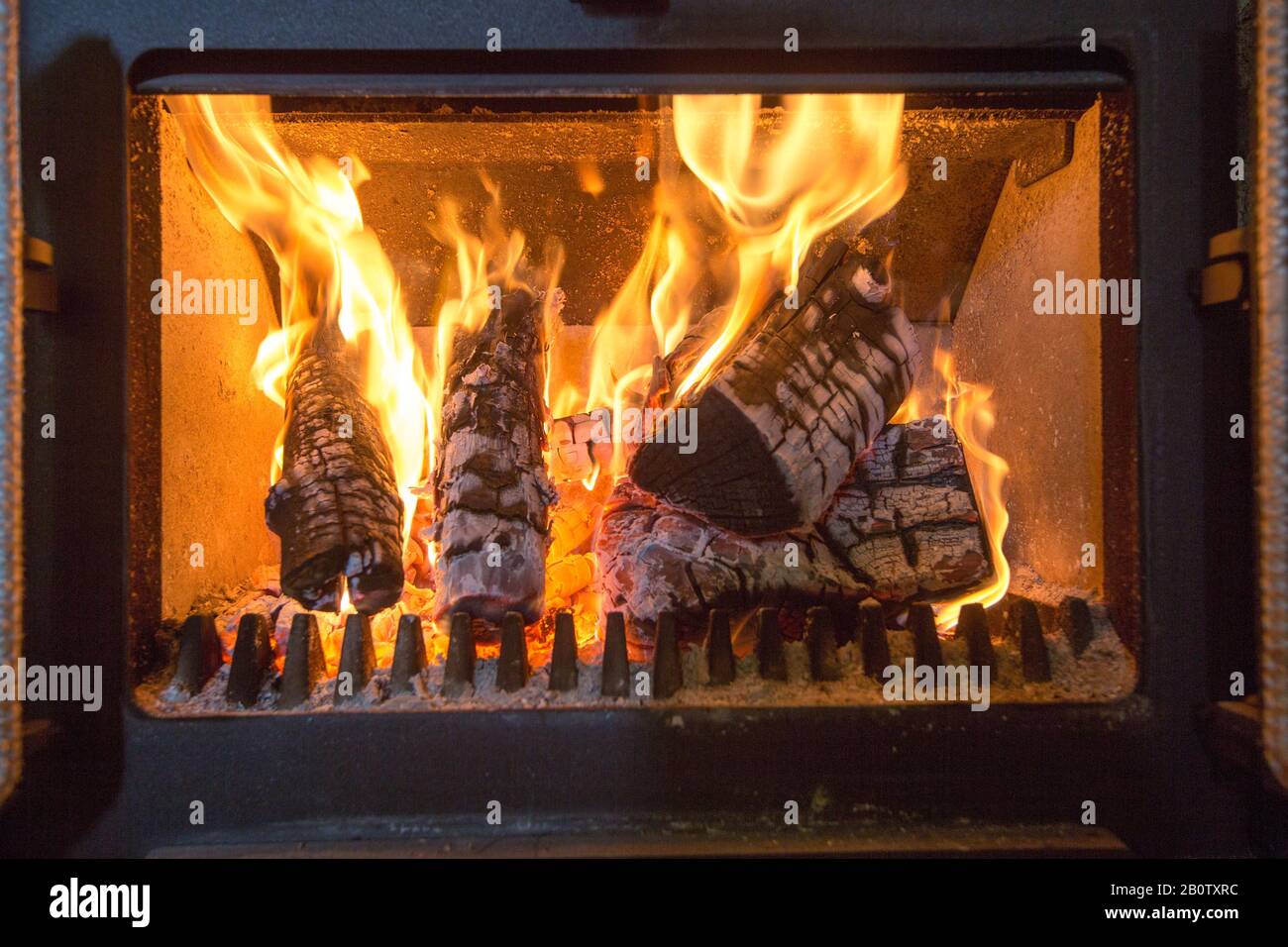 Piicture shows wood on fire in a wood burning stove.   Owners of wood burners, stoves and open fires will no longer be able to buy coal or wet wood to burn in them, under a ban to be rolled out from next year. Sales of the two most polluting fuels will be phased out in England to help cut air pollution, the government says. Bags of logs sold in DIY stores, garden centres and petrol stations often contain wet wood - a type of wood which produces more pollution and smoke. The public should move to 'cleaner alternatives', the government says. Stock Photo