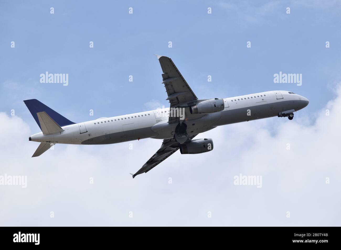 Plane taking off among clouds Stock Photo Alamy