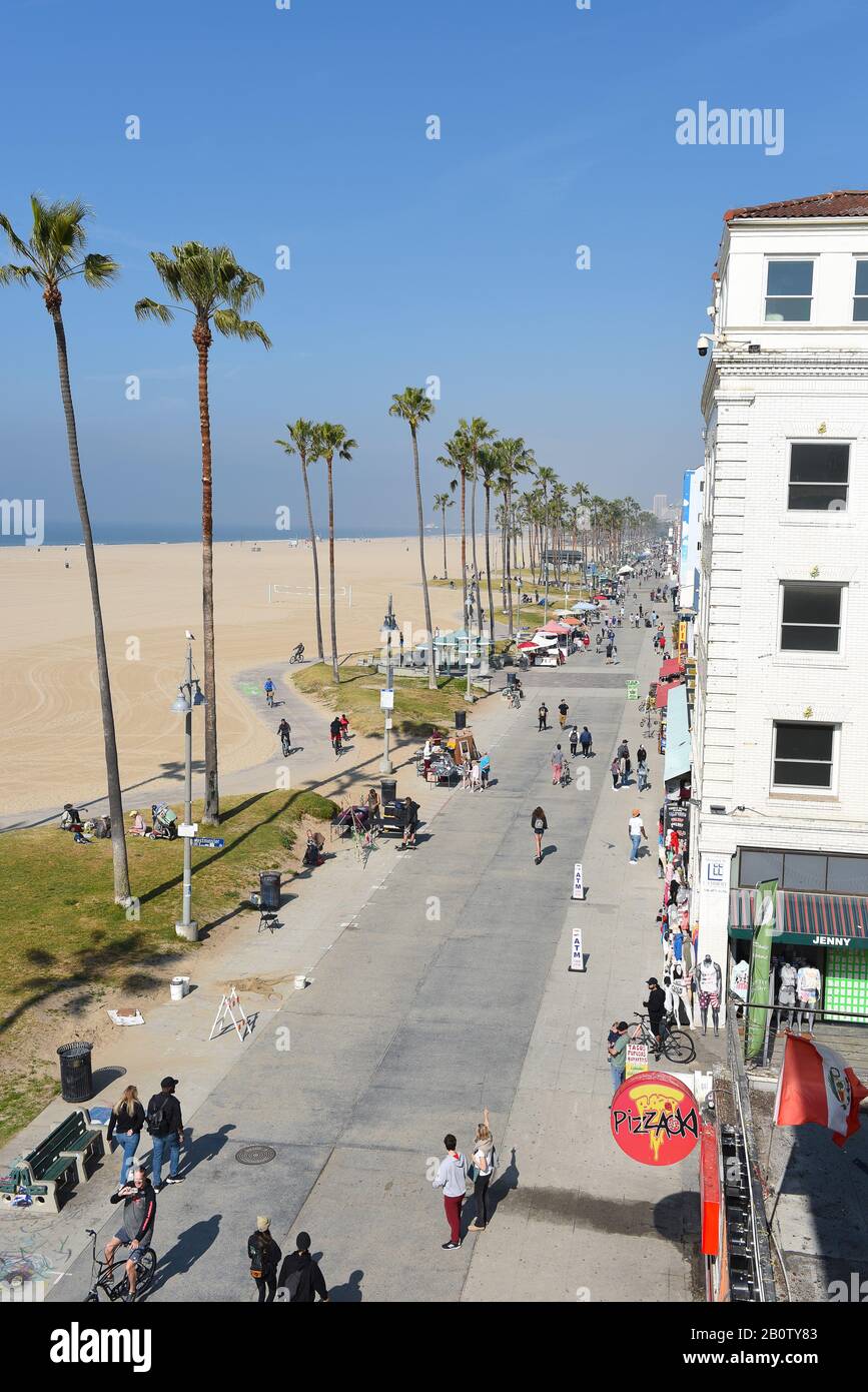 VENICE, CALIFORNIA - 17 FEB 2020: The Venice Beach Boardwalk with the ocean and sand looking north towards Santa Monica. Stock Photo