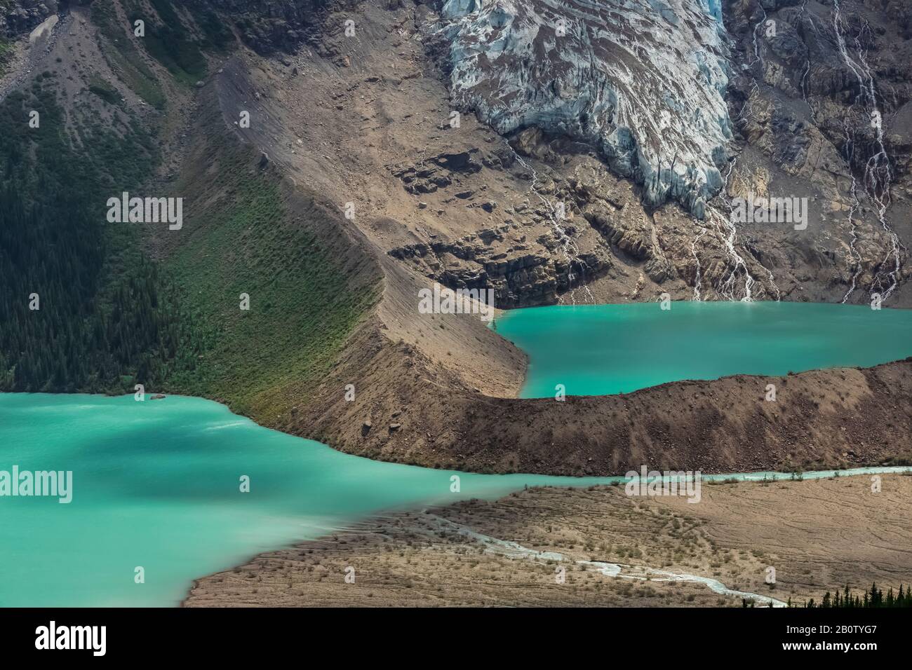 Cloud shadows on the surface of Berg Lake, with moraine around Mist Lake, in Mount Robson Provincial Park, British Columbia, Canada Stock Photo