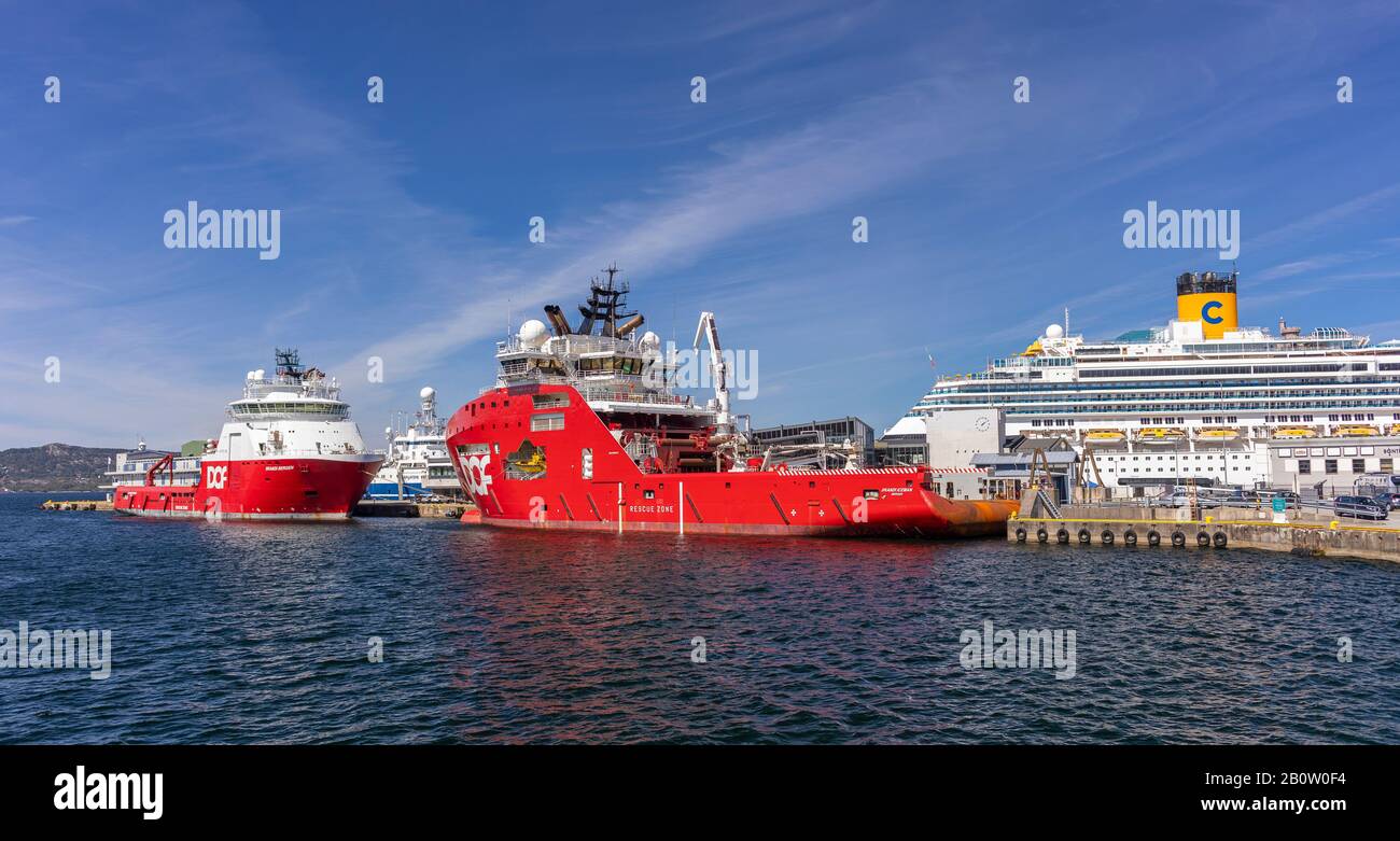 BERGEN, NORWAY - Commercial ships Scandi Bergen, left, and Scandi Iceman, deepsea anchor handling vessels, docked in harbour. Stock Photo