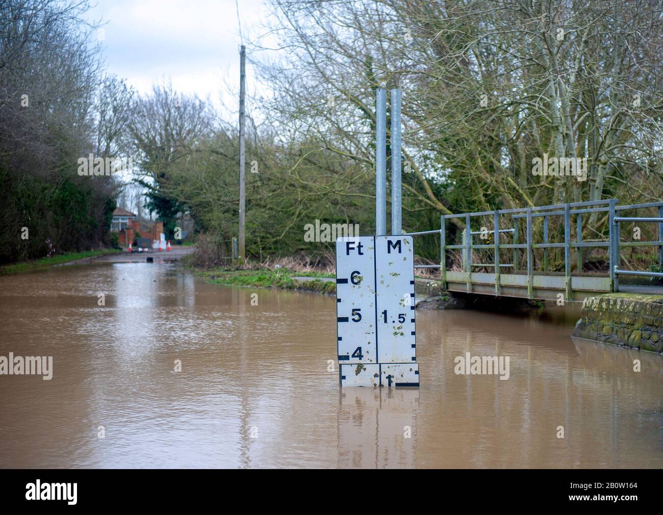 Cars stranded and houses cutoff due to rising flood waters, Watery