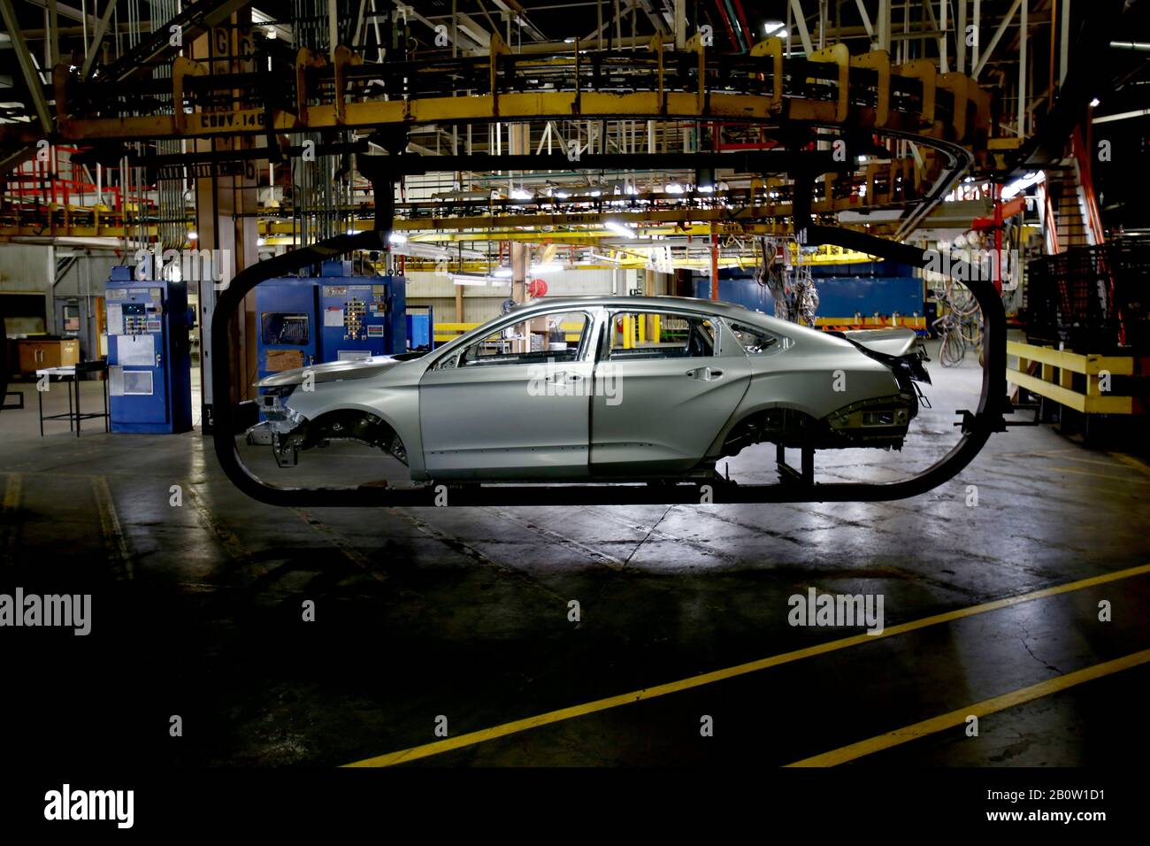 A 2020 Chevrolet Impala still yet to be painted is moved on a hoist on the  production line on Thursday, February 20, 2020 at the GM Detroit-Hamtramck  Assembly plant.The car is nearing