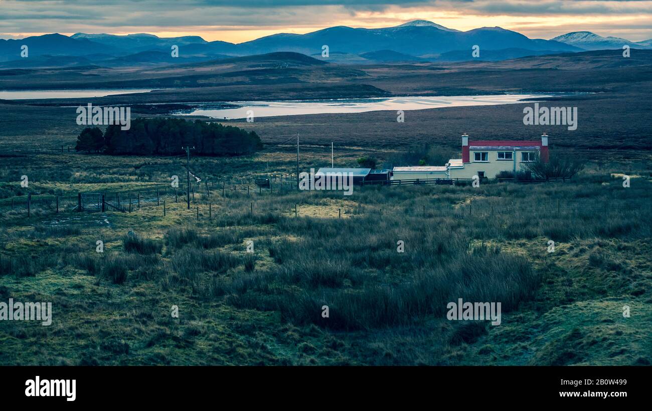 Lochs & Sunsets Outer Hebrides.Stornoway Isle of Lewis. Remote lodge set-on fishing loch surrounded with bold picturesque diversified beauty. Stock Photo