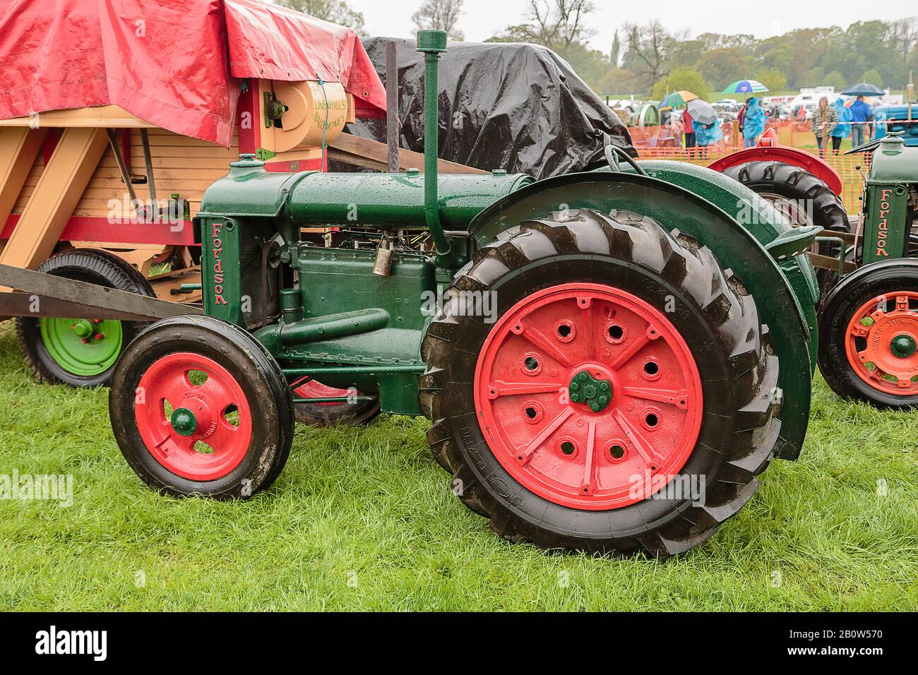 Green vintage Fordson tractor restored and working at a demonstration