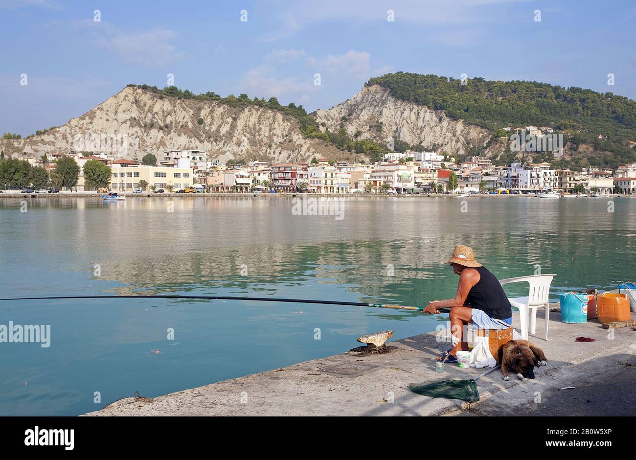 Man fishing at the harbour of Zakynthos-town, Zakynthos island, Greece Stock Photo