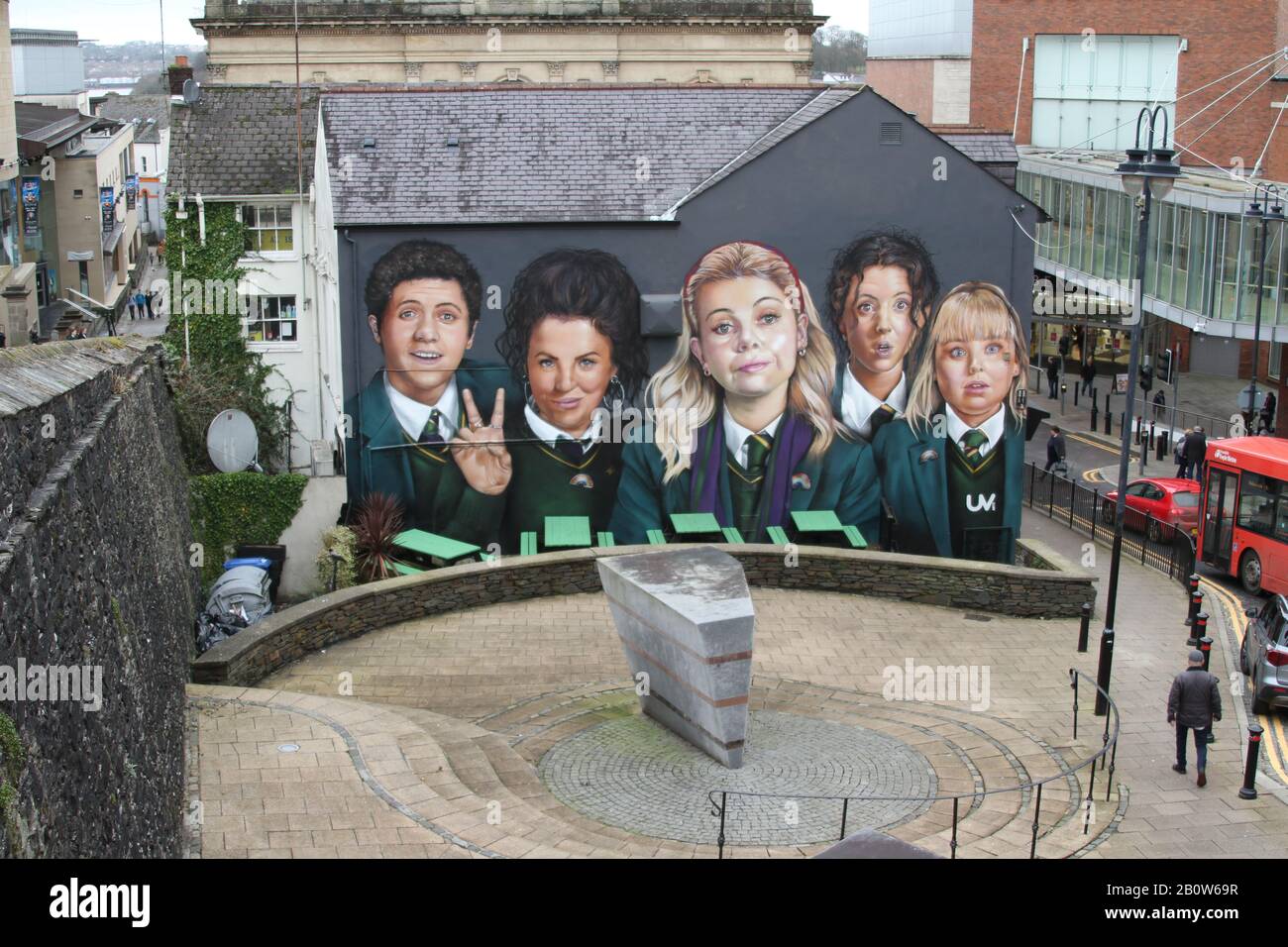 Large-scale colourful mural of Derry Girls TV characters painted in central Derry, Northern Ireland. Stock Photo