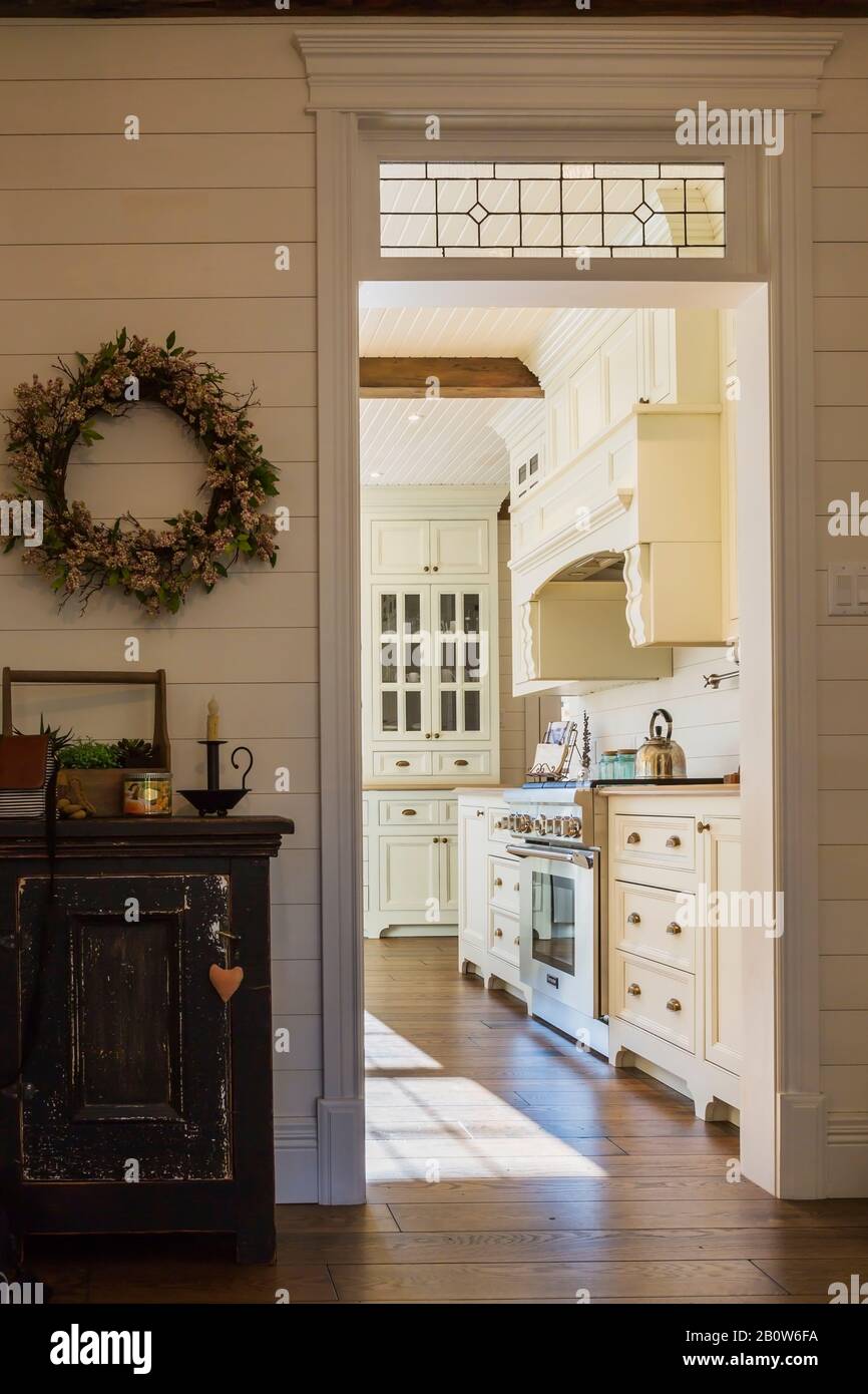 Interior view from hallway towards country style open plan kitchen with