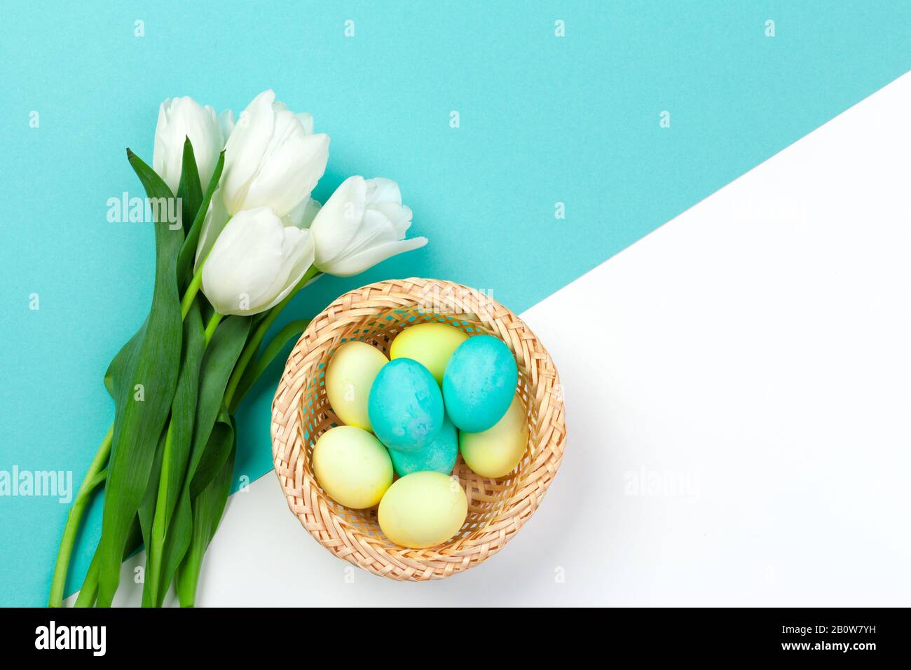 Easter background. colorful eggs in a nest of straw Stock Photo - Alamy