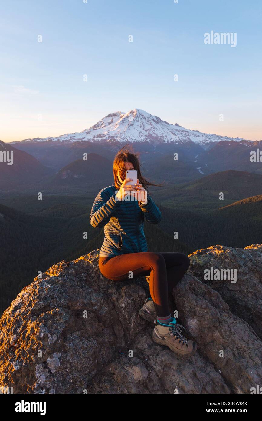 Female hiker in blue taking hi-res stock photography and images - Alamy