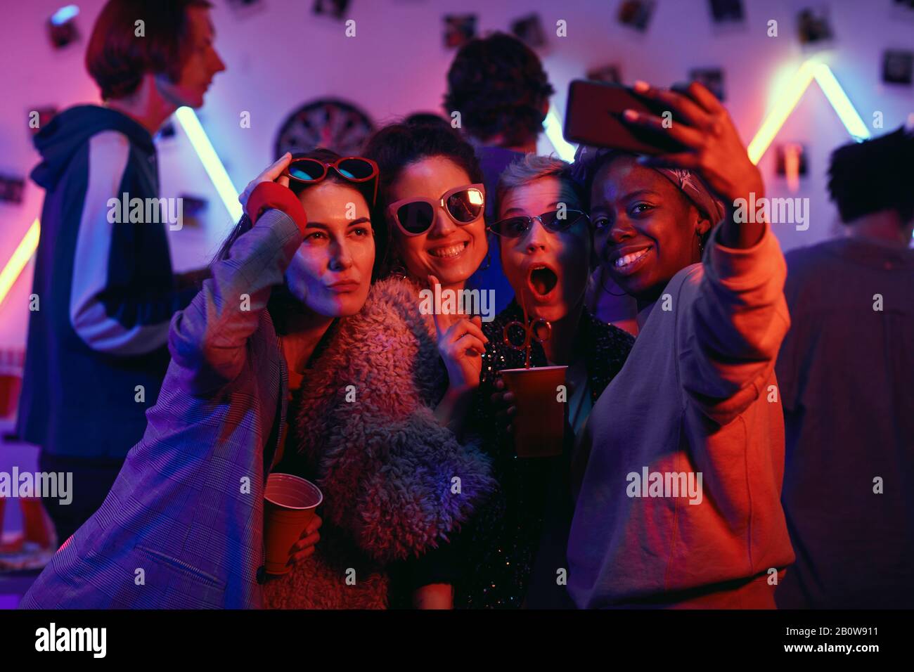 Smartphone Obsession At Night Club Party Stock Photo, Picture and Royalty  Free Image. Image 78105137.