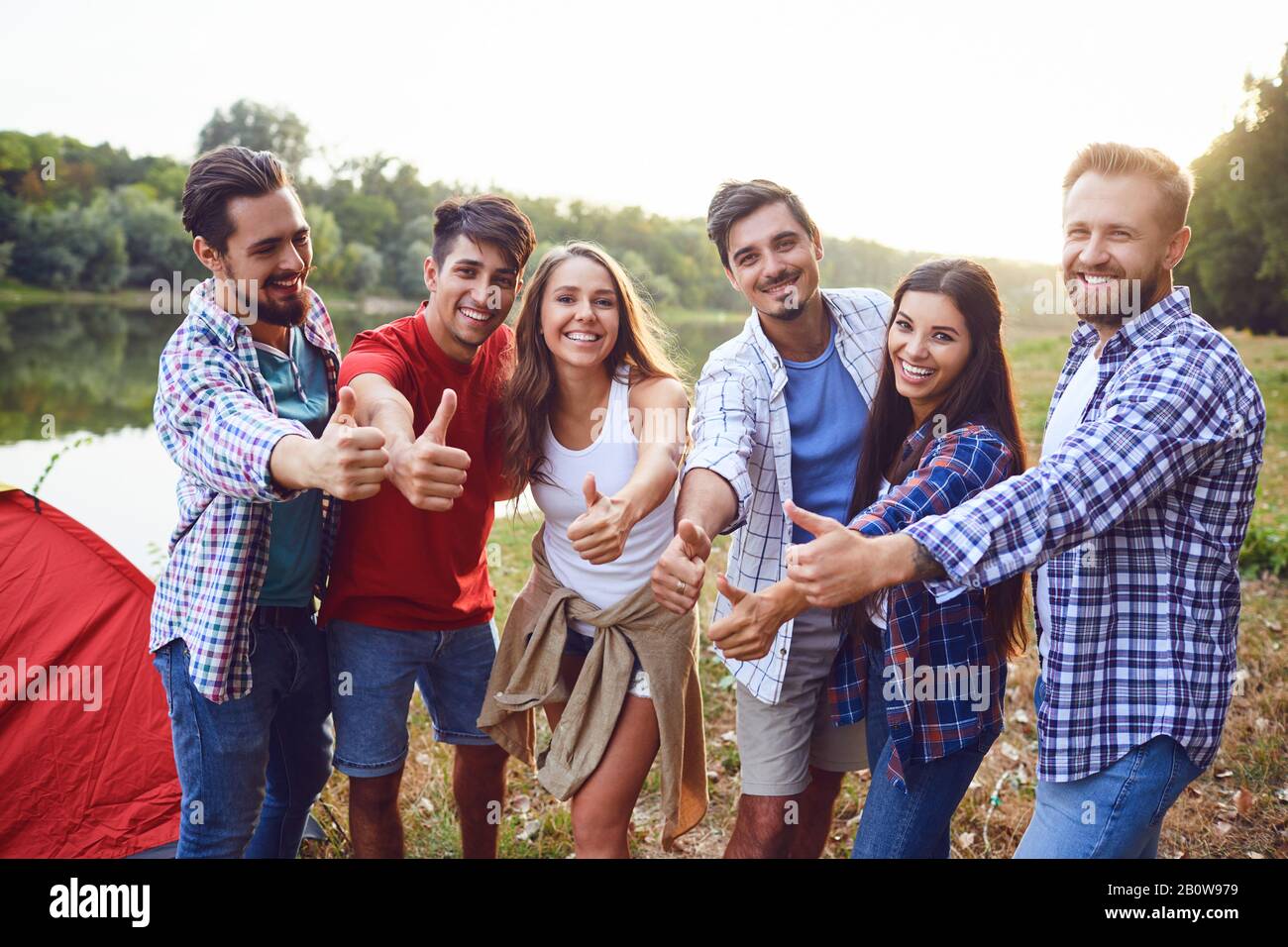 Group of people smiling standing on a picnic Stock Photo