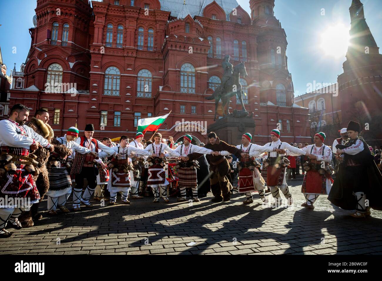 Moscow, Russia. 21st of February, 2020 People in ethnic costumes from Bulgarian village Aydemir dancing during the 2020 Moscow Maslenitsa Festival (Pancake Week) that celebrates the end of winter and marks the arrival of spring, in Manezhnaya Square in central Moscow, Russia Stock Photo