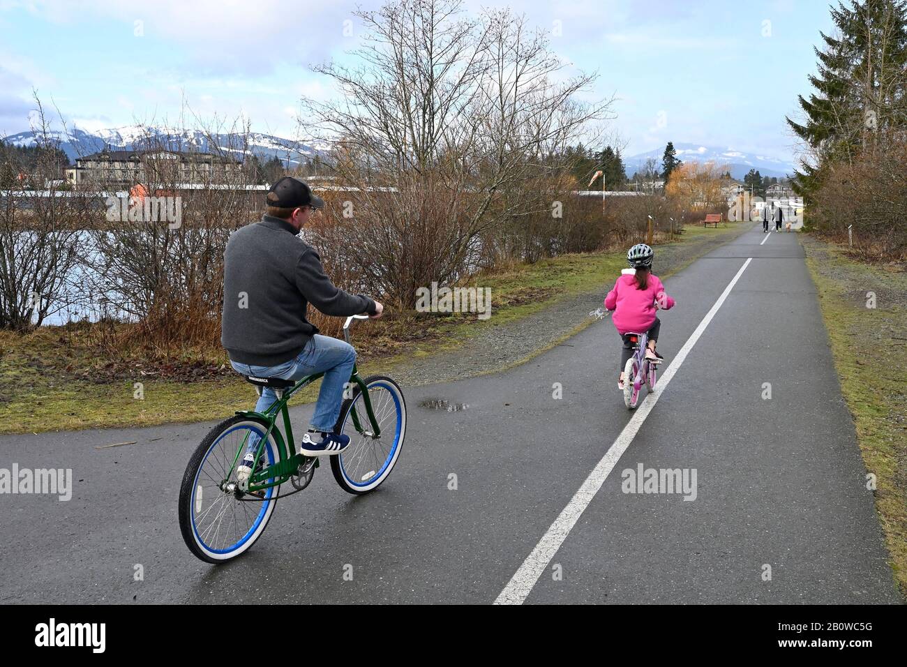 Two walking cyclists hi-res stock photography and images - Alamy