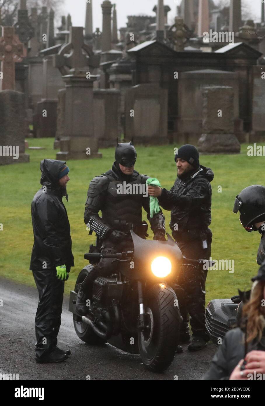 A Man Dressed As Batman During Filming At The Glasgow Necropolis Cemetery For A New Movie For The Surperhero Franchise Stock Photo Alamy
