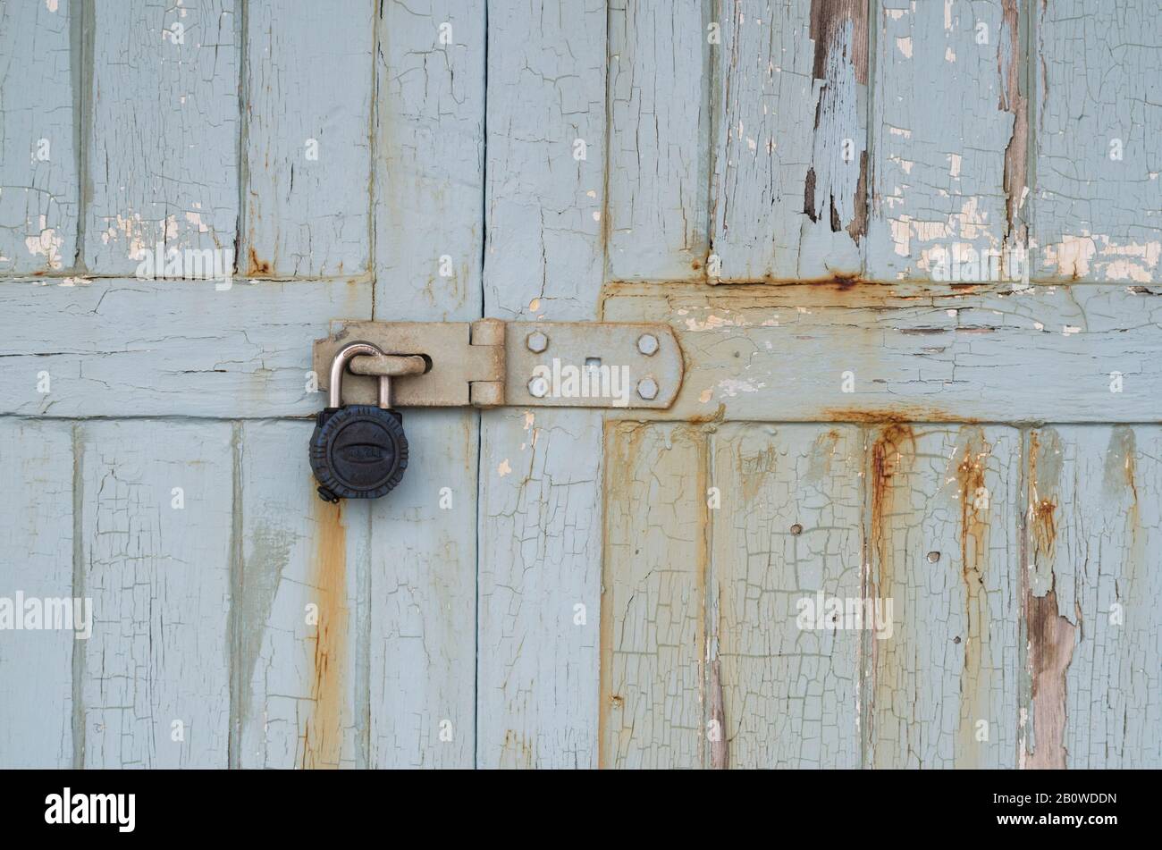 Salty sea air causes flaking paint and rust on Beach huts near Ferring