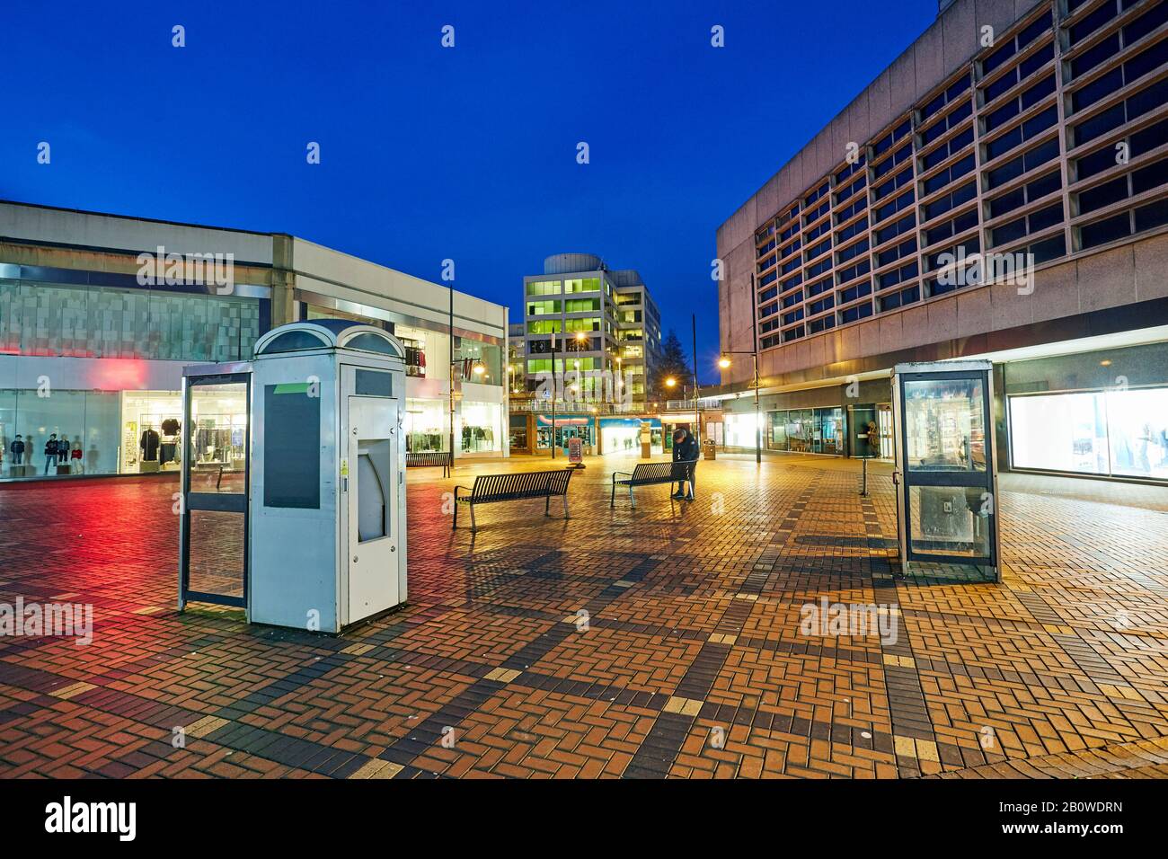 City centre of Swindon illuminated at night with telephone boxes Stock Photo