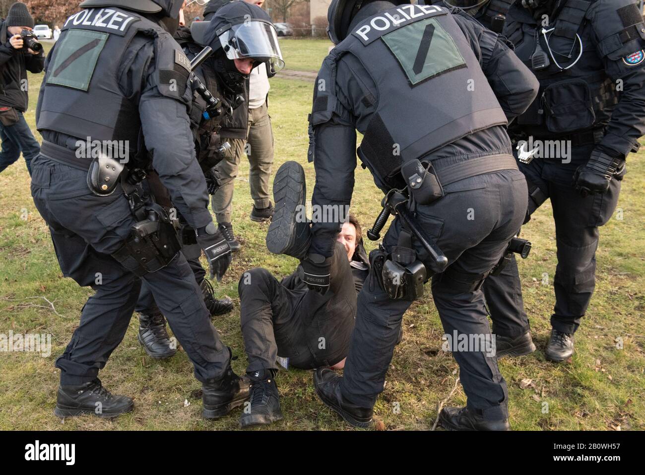 15th February 2020. Dresden, Saxony, Germany. Pictured: An anti-fascist demonstrator is restrained by police.  / Far-right groups converge on Dresden Stock Photo