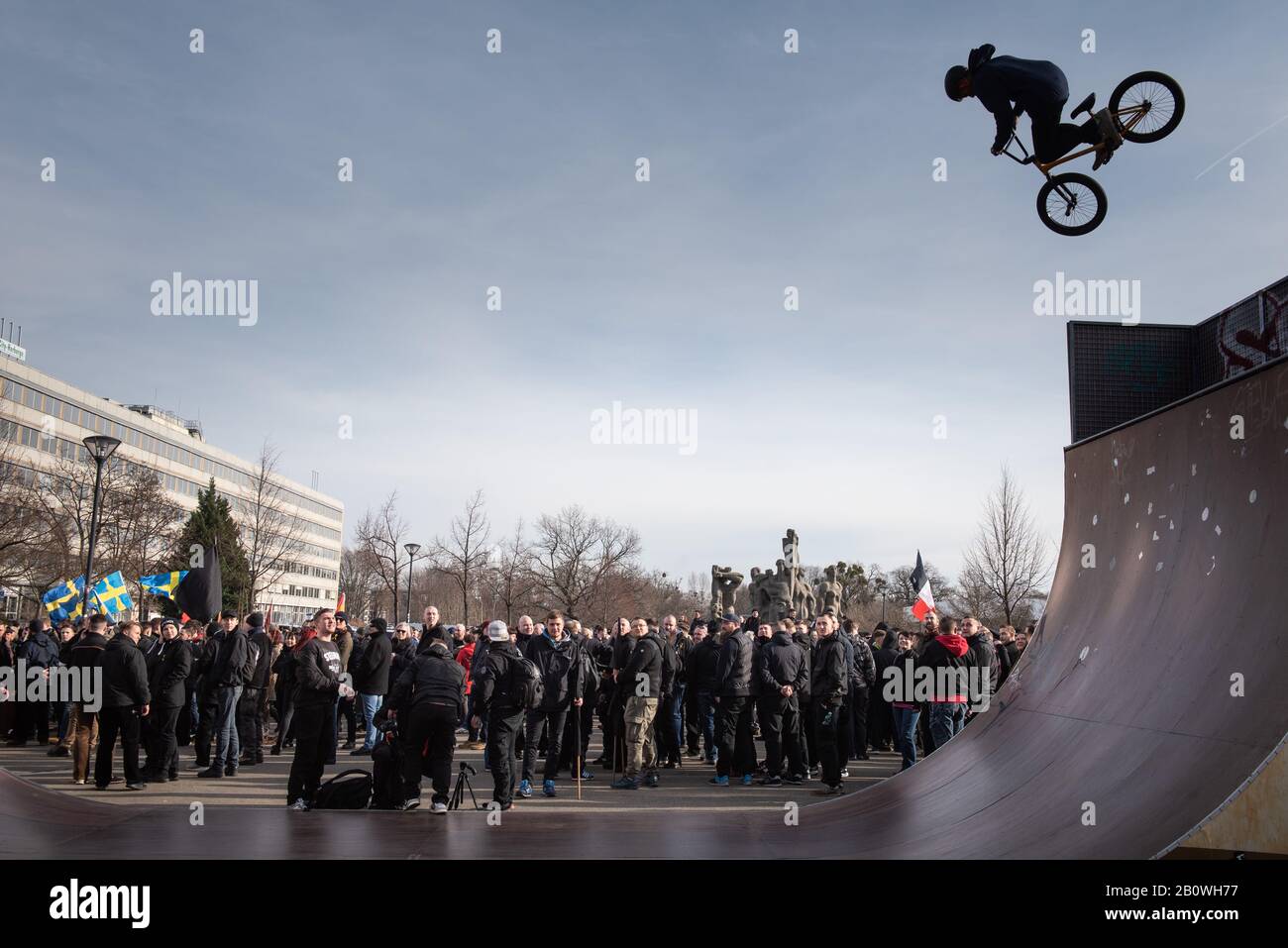 15th February 2020. Dresden, Saxony, Germany. Pictured:  A biker performs at stunt at Dresden's Lingneralle Skatepark where the far-right march began. Stock Photo