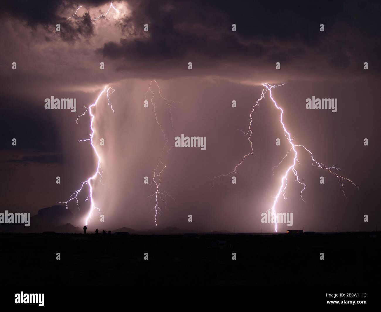 Lightning striking in the Gila bend Mountains during the 2006 Arizona Monsoon. Stock Photo