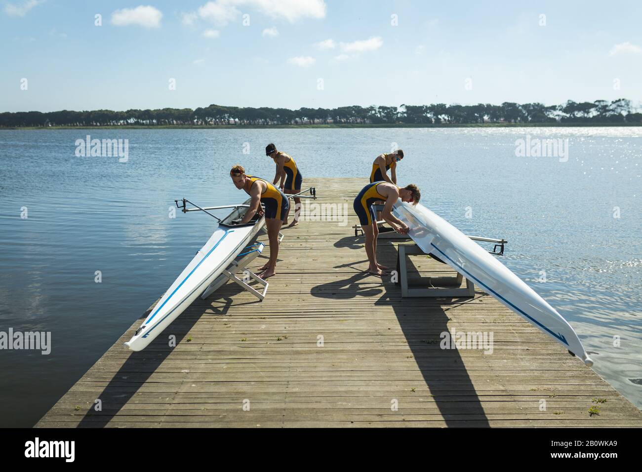 Teammates ready to go rowing Stock Photo