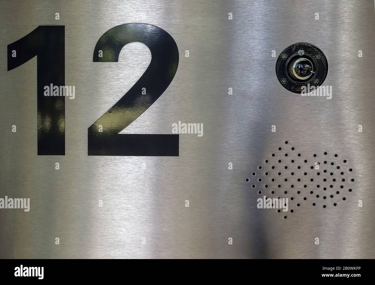 House number with surveillance camera Stock Photo