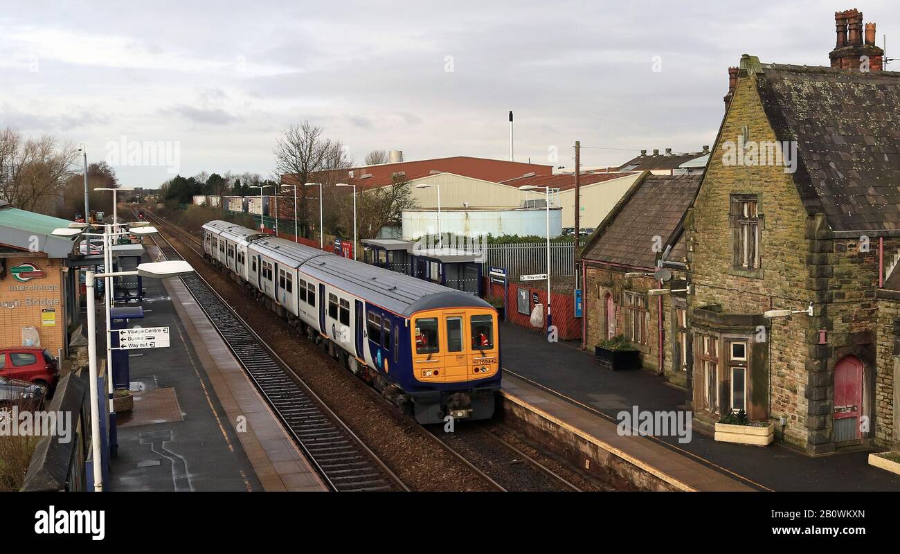 One of Northern’s “new” bi-mode trains passes Burscough Bridge on a test run from Southport to Wigan on 13.2.2020. Unit no 769 442. Stock Photo
