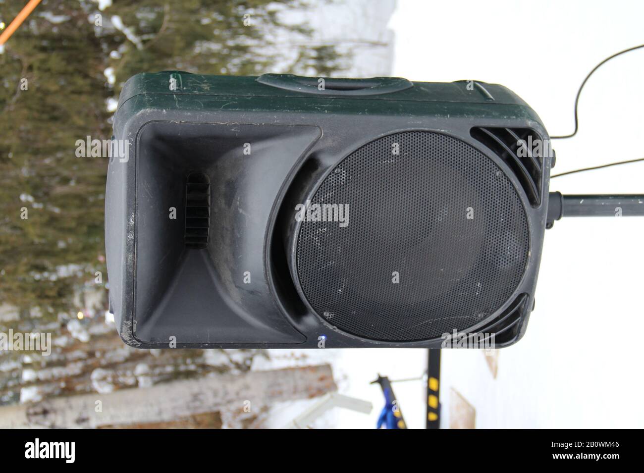 Street loudspeakers at a music festival on winter forest background. Stock photo stories format with empty space for text and design.  Stock Photo