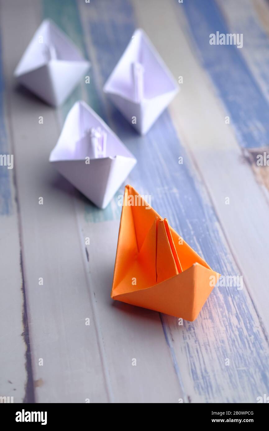 leadership concept with paper boat on table  Stock Photo