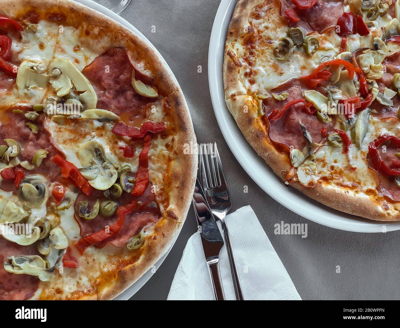 Ready to eat crusty pizza, junk food Stock Photo Alamy