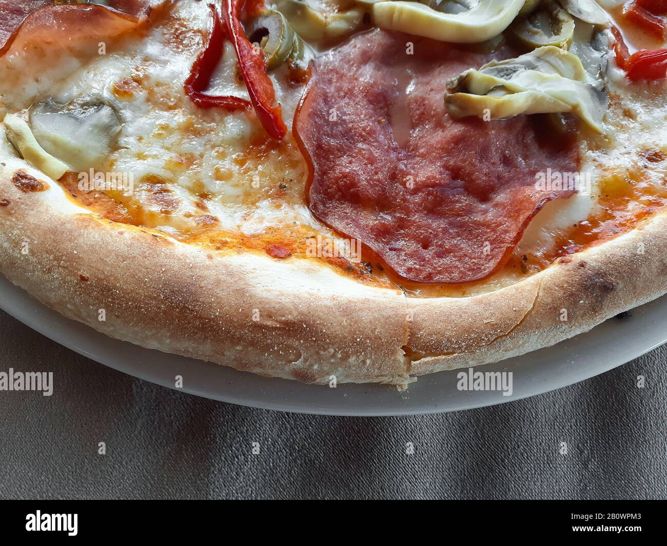 Ready to eat crusty pizza, junk food Stock Photo Alamy