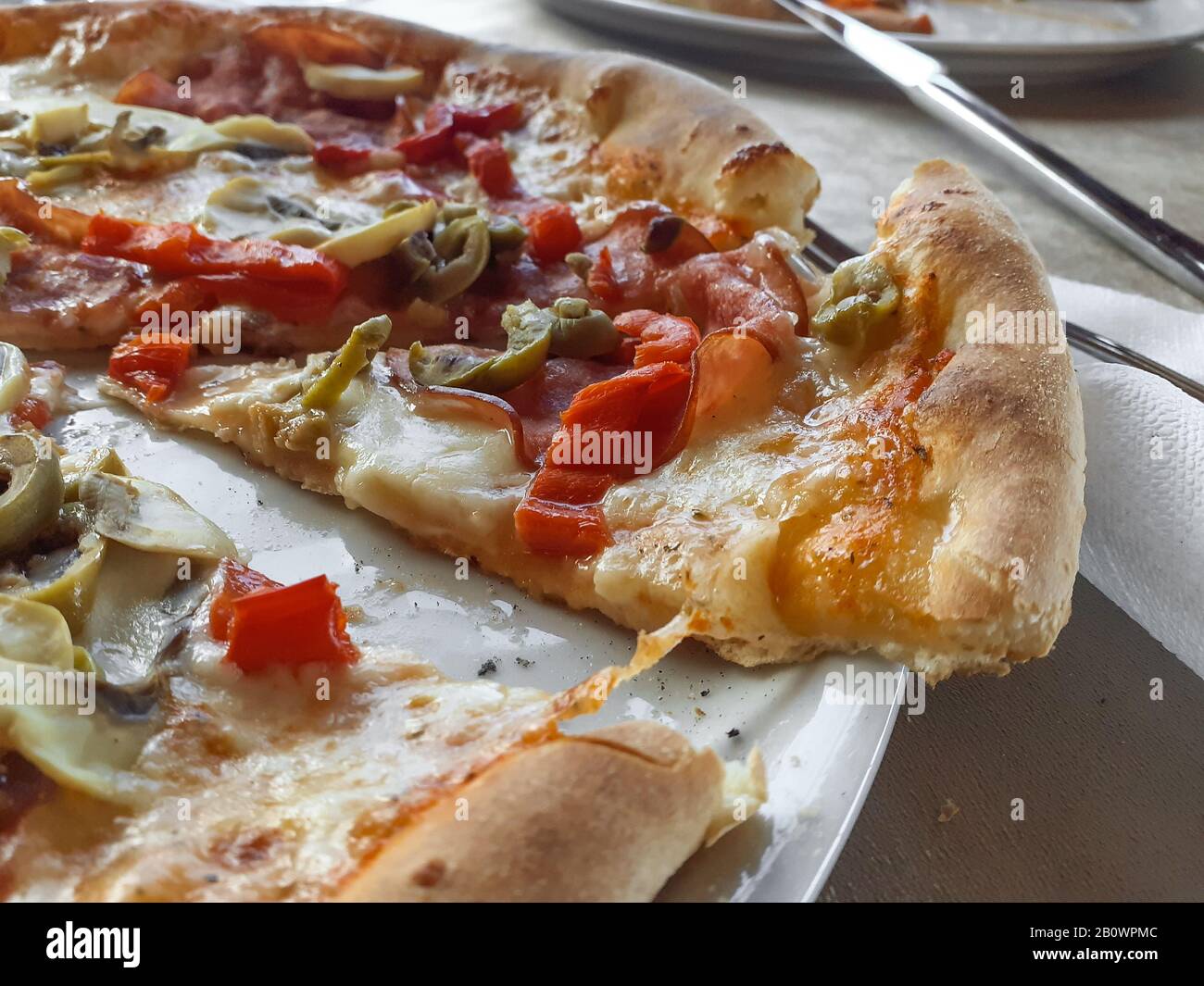 Ready to eat crusty pizza, junk food Stock Photo Alamy