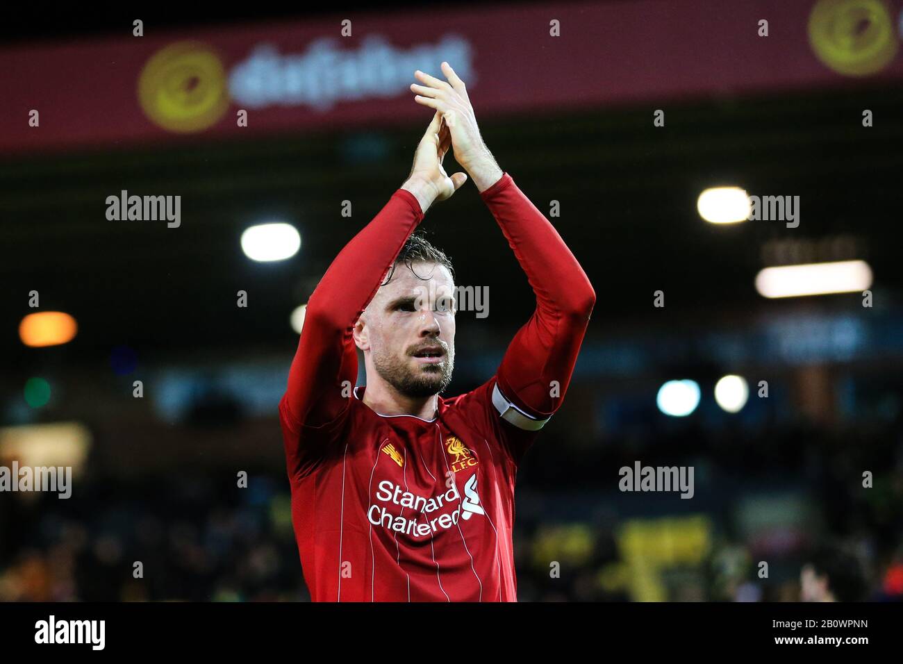 15th February 2020, Carrow Road, Norwich, England; Premier League, Norwich City v Liverpool : Jordan Henderson (14) of Liverpool applauds their fans following the final whistle Stock Photo