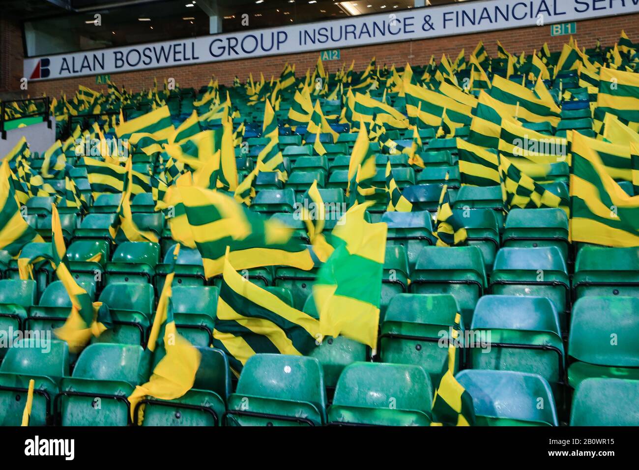15th February 2020, Carrow Road, Norwich, England; Premier League, Norwich City v Liverpool : Supporters flags blow in the gusts as Storm Dennis reaches Norwcih Stock Photo