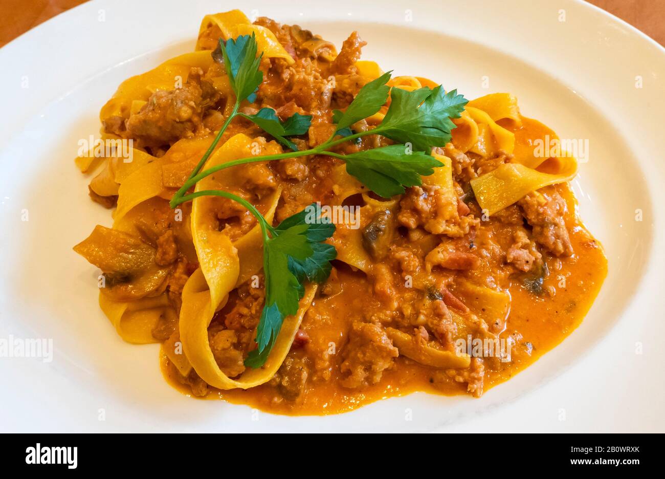 A bowl of pappardelle pasta with a rustic meat sauce Stock Photo Alamy