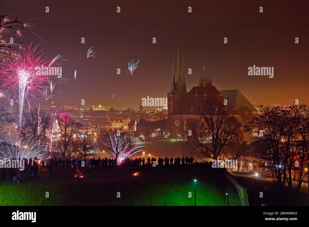 New Year's fireworks with cathedral and Severikirche in Erfurt, Thuringia, Germany Stock Photo