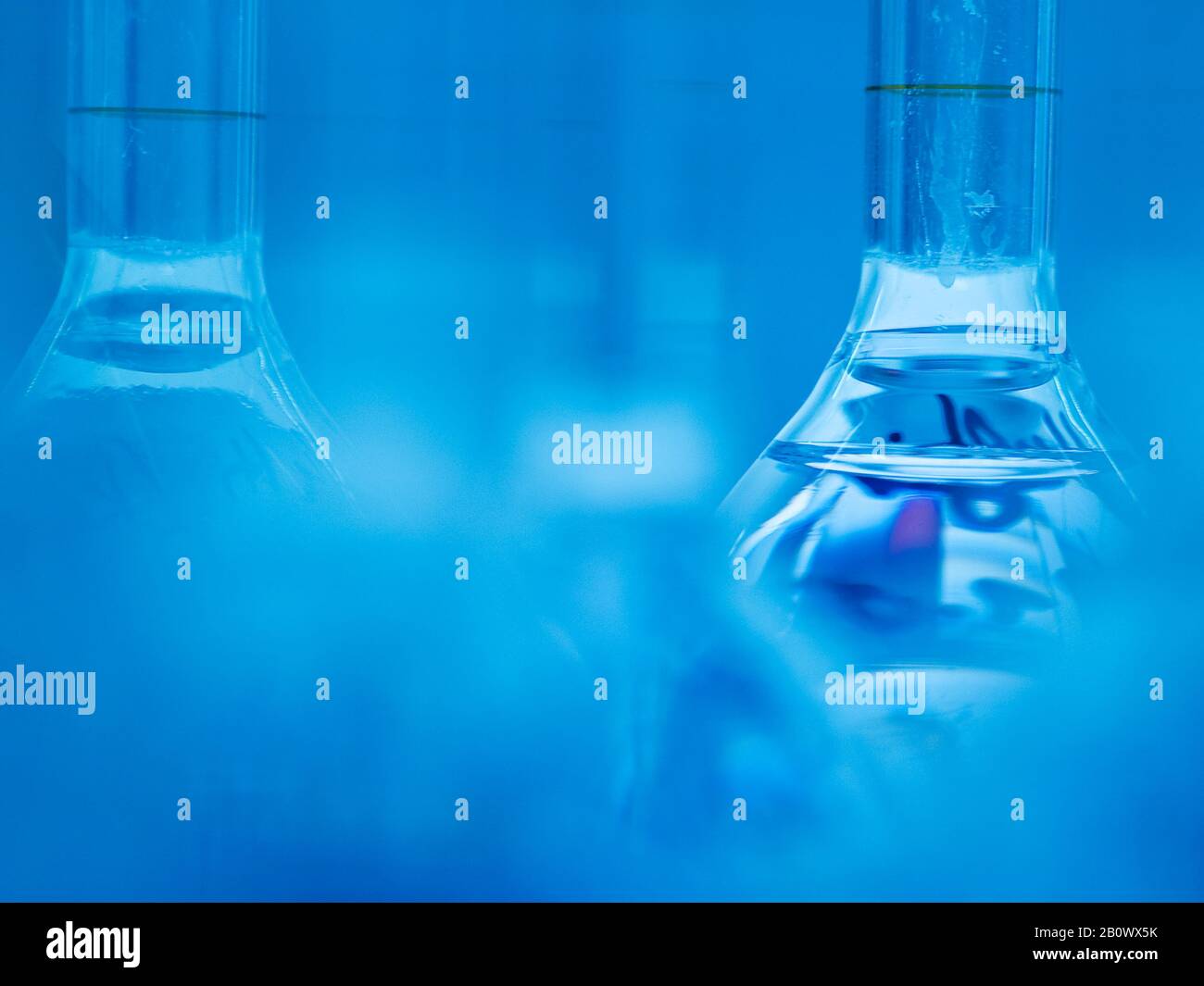 Measuring bottles in the laboratory Stock Photo - Alamy