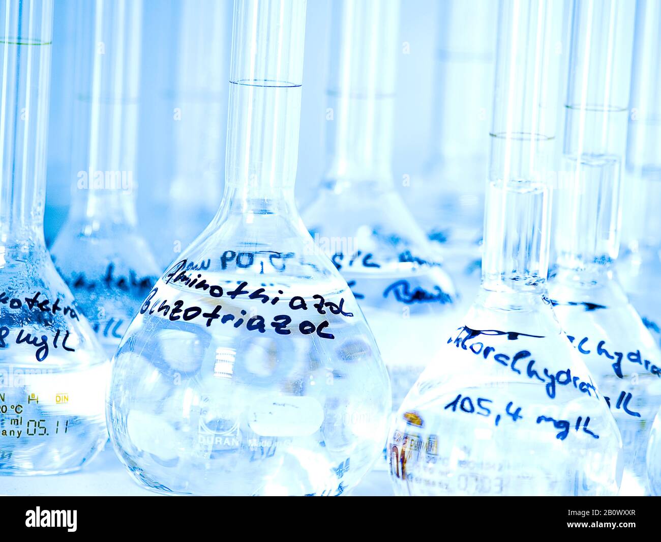 Measuring bottles in the laboratory Stock Photo - Alamy