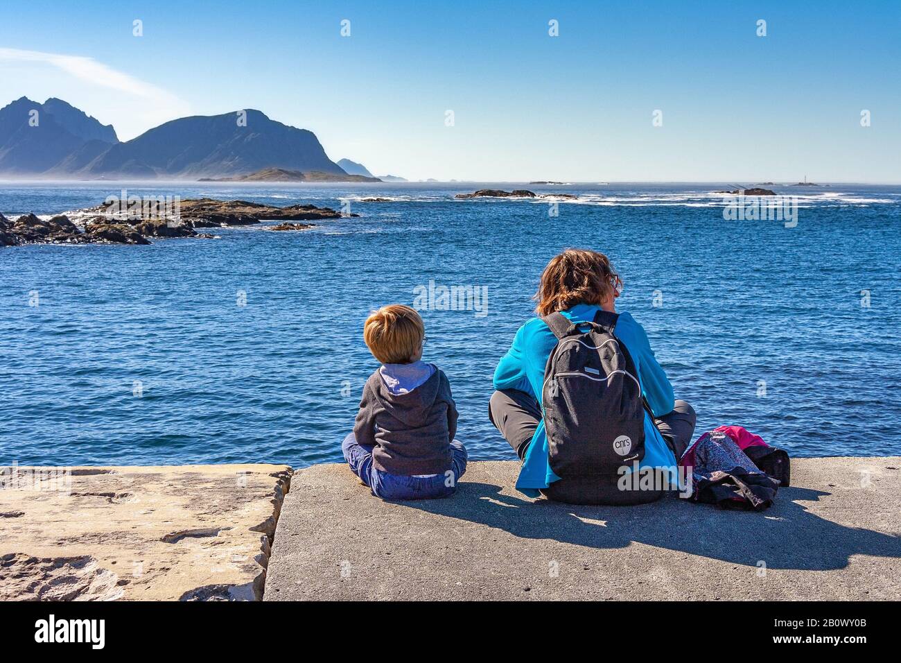 Mother and son in old village of Nyksund in vesteraalen. Stock Photo
