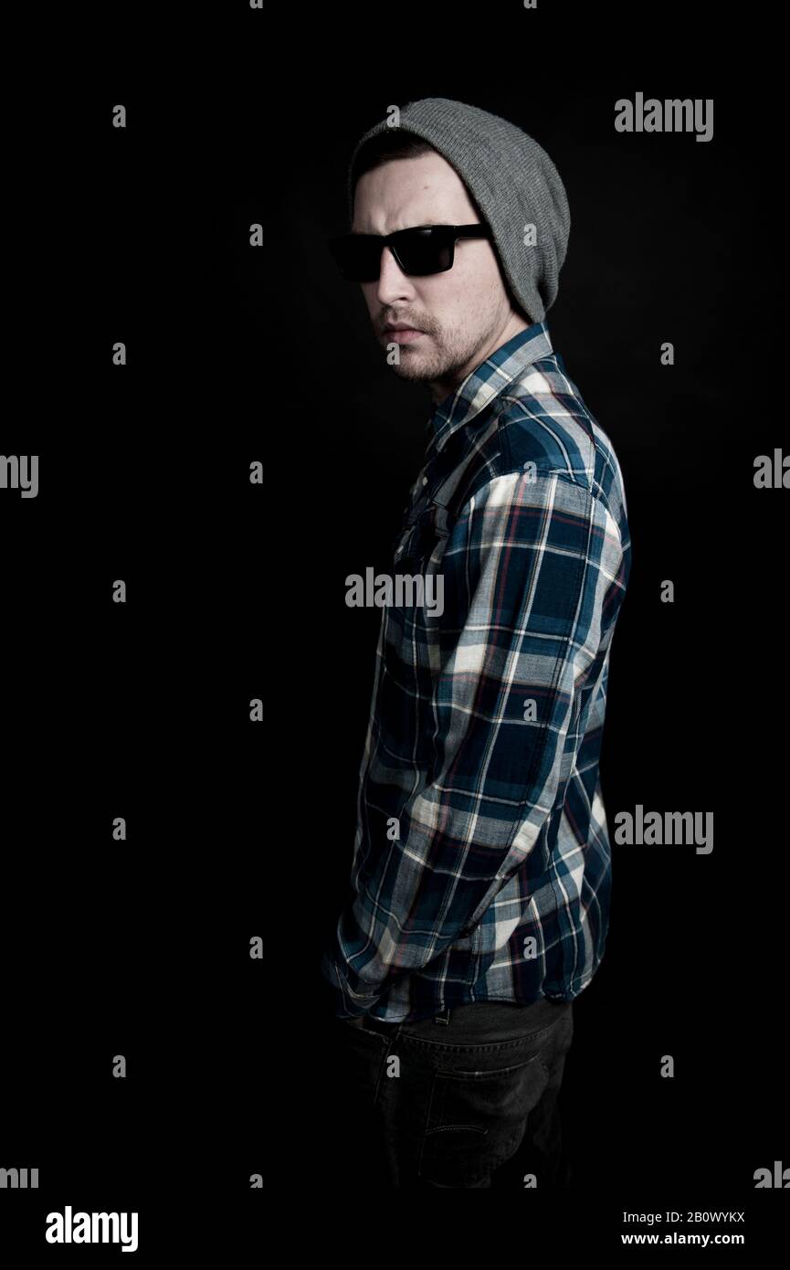 Young man in hat and sunglasses Stock Photo