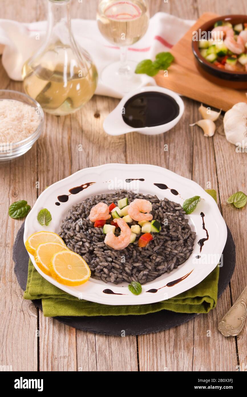 Squid ink risotto Stock Photo - Alamy