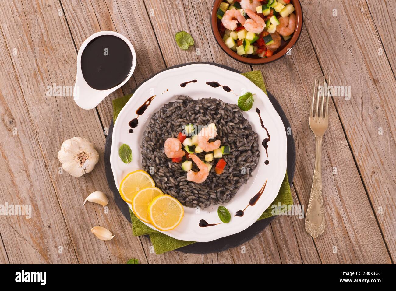 Squid ink risotto Stock Photo - Alamy