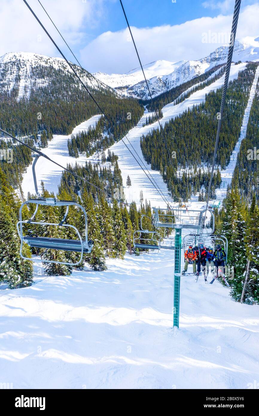 Skiers snowboarders ride on snowy hi-res stock photography and images ...