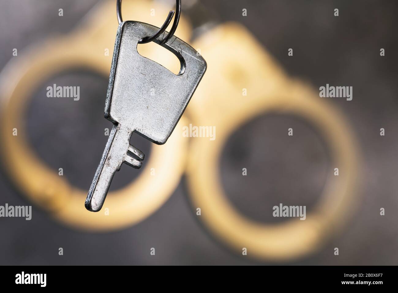 Key and handcuffs, close-up. The concept on the key to freedom Stock Photo