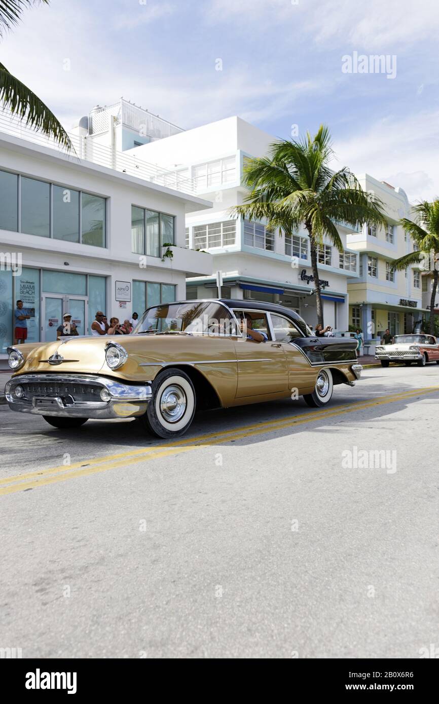 gold-colored Oldsmobile Holiday 88, year of construction 1956, fifties, classic American car, Ocean Drive, South Miami Beach, Art Deco District, Florida, USA, Stock Photo