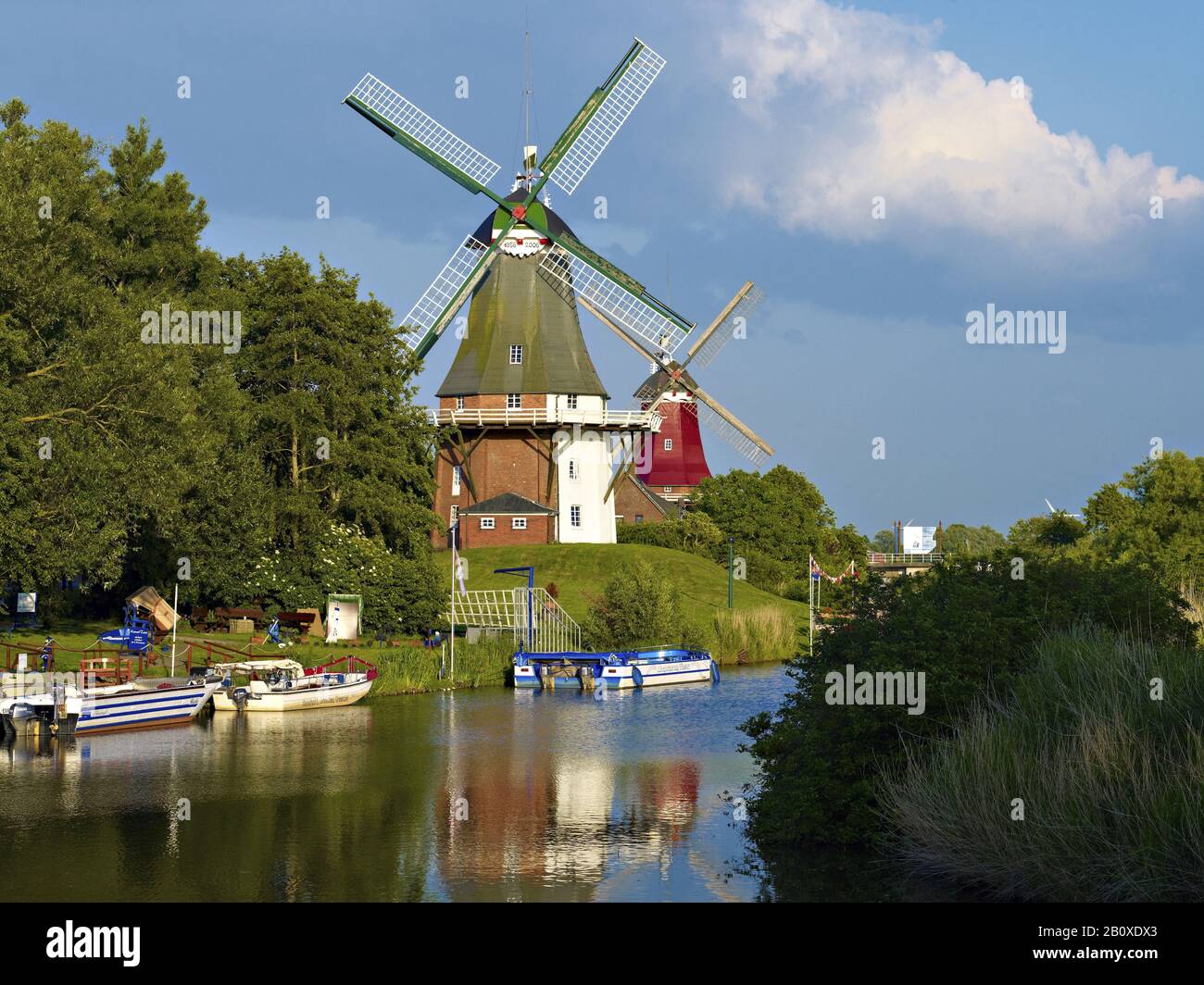 Twin windmills at the Siel in Greetsiel, East Frisia, Lower Saxony, Germany Stock Photo