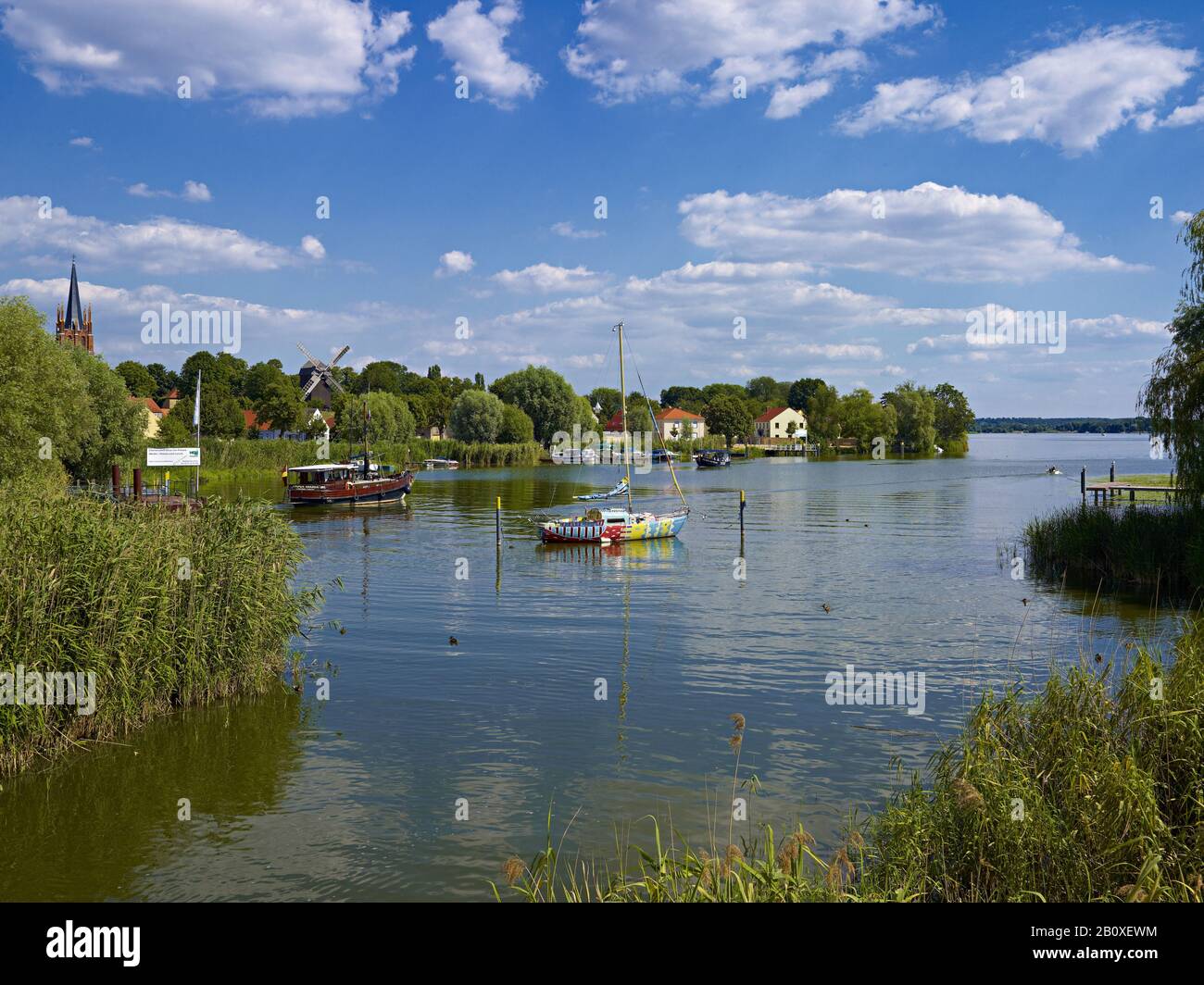 Historic city center with post mill and sailing boat 'Havelwunder' in Werder, Brandenburg, Germany, Stock Photo