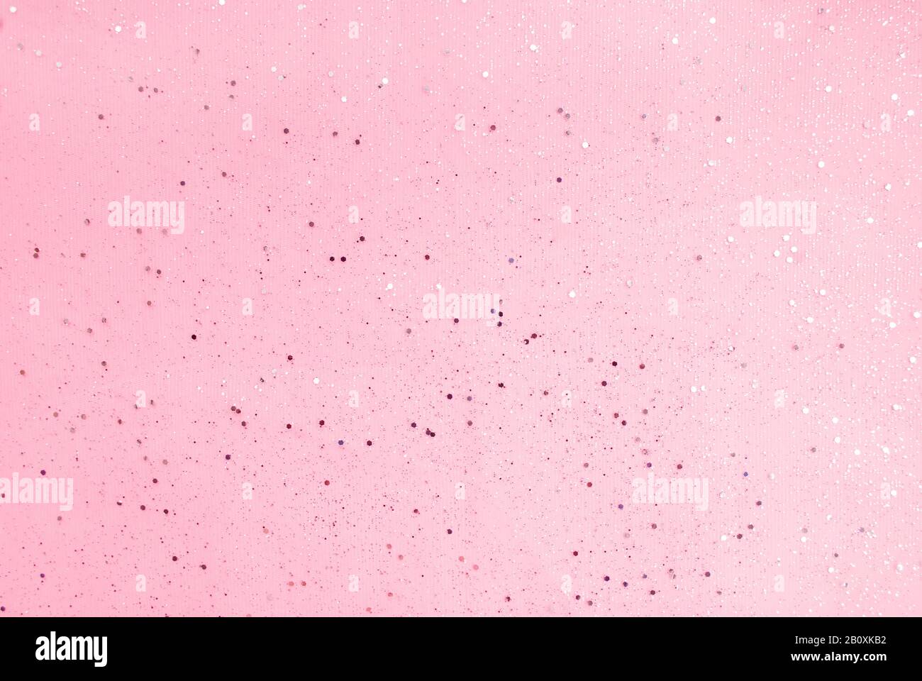 Pink background with small sparkles. Flat lay. Top view. Stock Photo